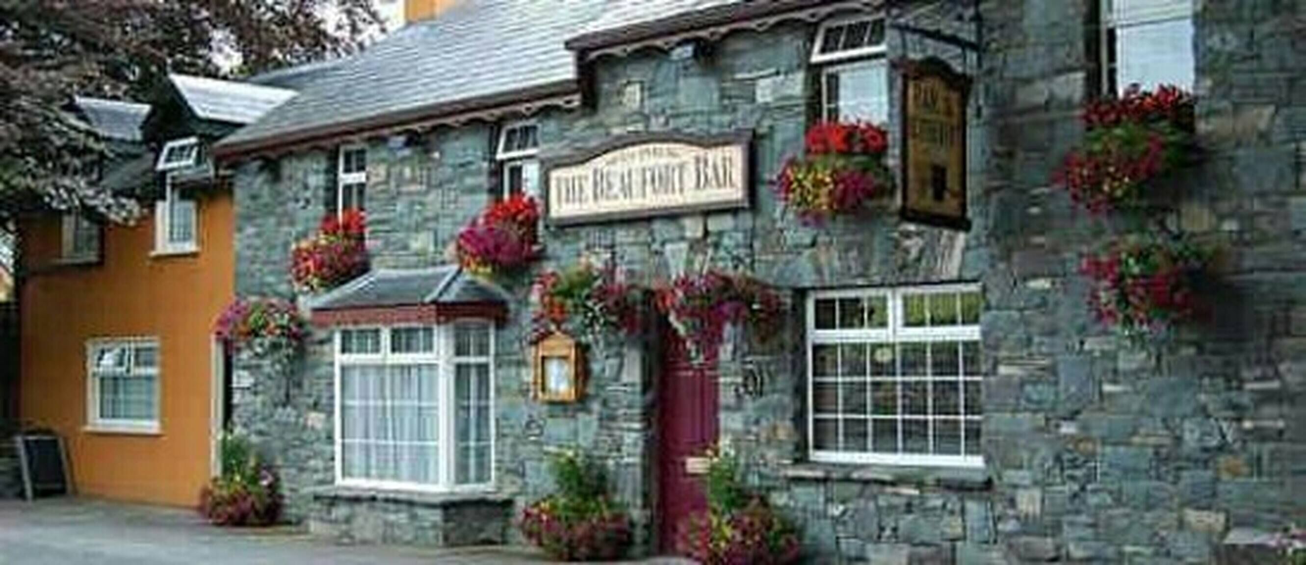 A stone building with a sign reading "The Beaufort Bar".