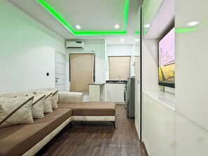 Economy Apartment, Balcony, City View | Living area | Flat-screen TV - Aradu Apartment  (Abuja)