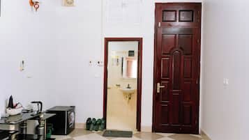 Basic Double Room Single Use | Bathroom | Hair dryer, towels, soap, shampoo