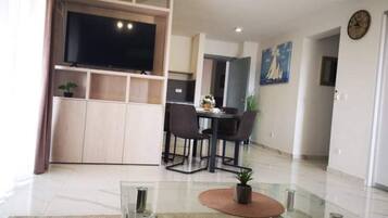 Apartment (One Bedroom apartment with Balcony an) | Living room | 32-inch flat-screen TV with satellite channels