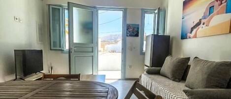 Standard Apartment, Balcony, City View | Living area | TV