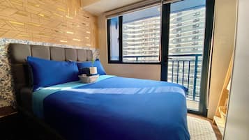 Design Condo, Balcony, Pool View | Down comforters, iron/ironing board, free WiFi, bed sheets