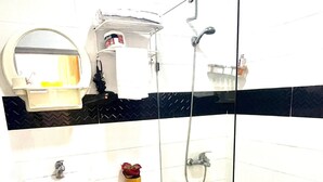 A bathroom with a toilet, sink, and shower. - Room-royal Terrace Queen 1 (Puerto Plata)