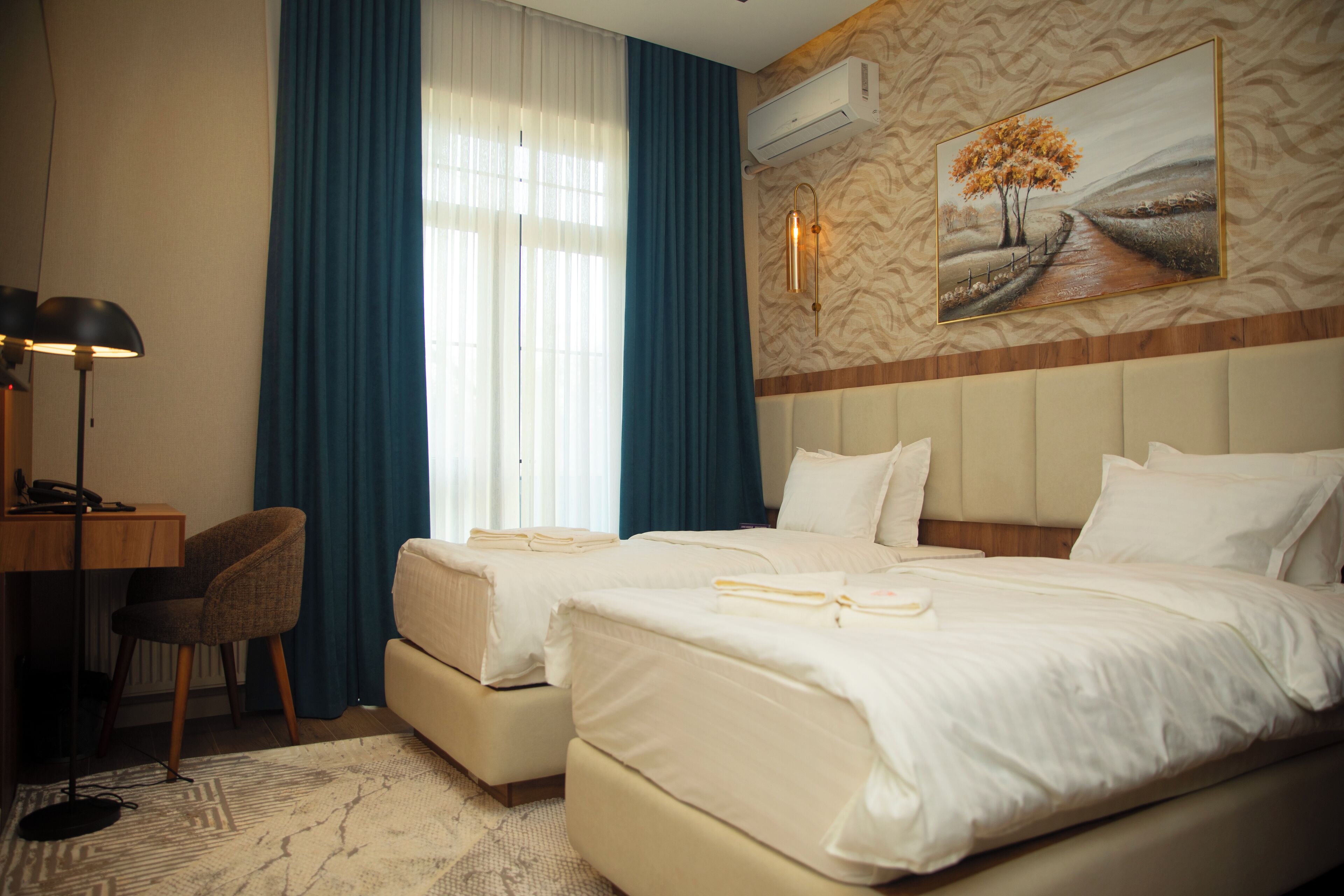 Deluxe Room, Balcony, City View | In-room safe, desk, laptop workspace, blackout curtains