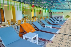 Outdoor pool, open 7:00 AM to 8:00 PM, pool umbrellas, pool loungers