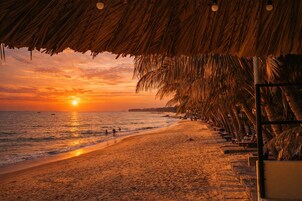 Private beach, white sand, sun loungers, beach umbrellas