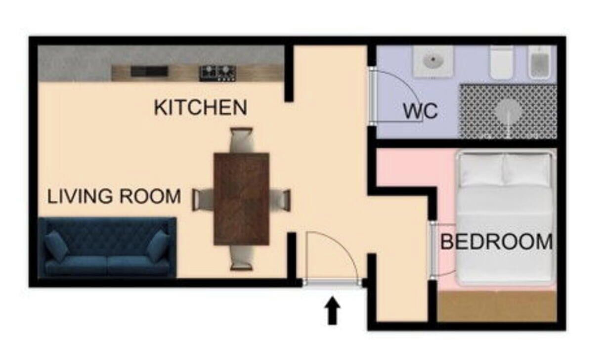 A floor plan of a hotel room with a kitchen, living room, WC, and bedroom.