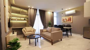Deluxe Apartment, City View | Living area | 55-inch Smart TV with digital channels, Netflix, Hulu