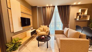 Deluxe Apartment, City View | Living area | 55-inch Smart TV with digital channels, Netflix, Hulu