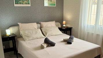 1 bedroom, desk, iron/ironing board, travel crib