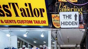 A tailor shop with mannequins displaying suits and shirts. - The Hidden Khaosan (Bangkok)