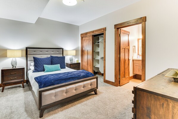 A bedroom with a bed, nightstands, a dresser, and a closet. - Luxe Eden Gem w/ Hot Tub: 6 Mi to Powder Mountain! (Eden)