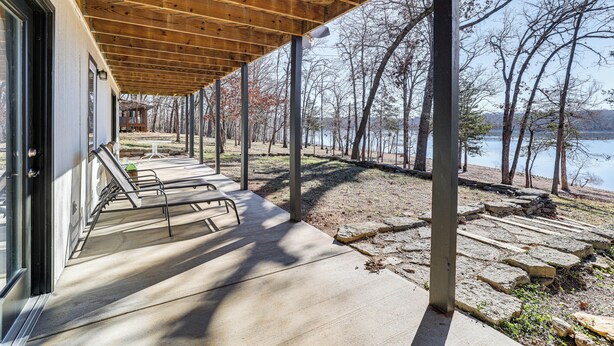 A covered outdoor area with benches and a view of a lake. - Waterfront Deck, Shell Knob Gem on Table Rock! (Shell Knob)