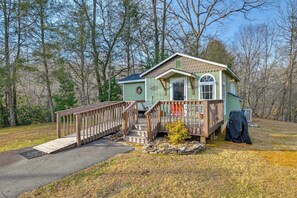 A small cabin with a wooden deck, a front porch, and a stone foundation. - Hike, Swim & Fish On-site: Blue Ridge Mtn Getaway (Thurmond)