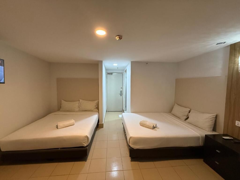 Deluxe Quadruple Room, 2 Queen Beds, Non Smoking, Private Bathroom | Desk, laptop workspace, blackout drapes, iron/ironing board