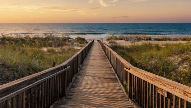 A wooden boardwalk leading to the beach. - Oceanfront Villa | Pool | Beachfront Living (Hilton Head Island)