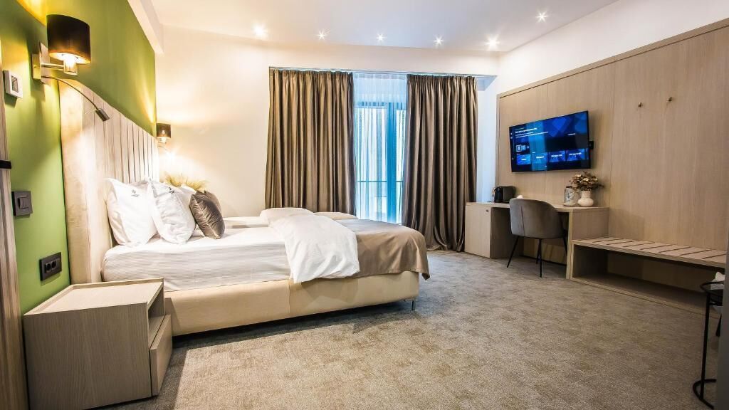 Deluxe Twin Room, Balcony | In-room safe, iron/ironing board, free WiFi