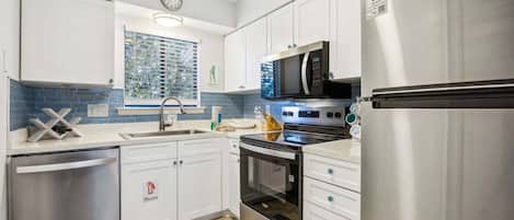 Condo, 2 Bedrooms | Private kitchen | Fridge, oven, coffee/tea maker