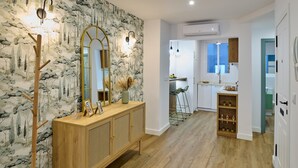 A modern kitchen with white cabinets, a wooden countertop, and a built-in stove. - El Mirador de Neptuno: Your Private Balcony Over Priego de Córdoba’s History (Priego de Córdoba)