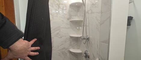 Shower, hair dryer, towels, soap