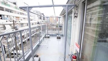 Basic Triple Room, Multiple Beds, Balcony, City View | Terrace/patio