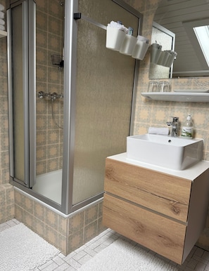 Shower, hair dryer, towels, soap