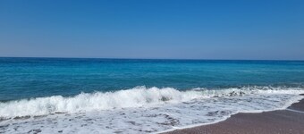 Self-sufficient straw bale house in organic olive grove, with sea view