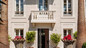 A two-story building with a symmetrical facade, large windows, and a central entrance. - MAISON DOMINOS Villa Pâquerette avec Piscine, Marseille (Marseille)