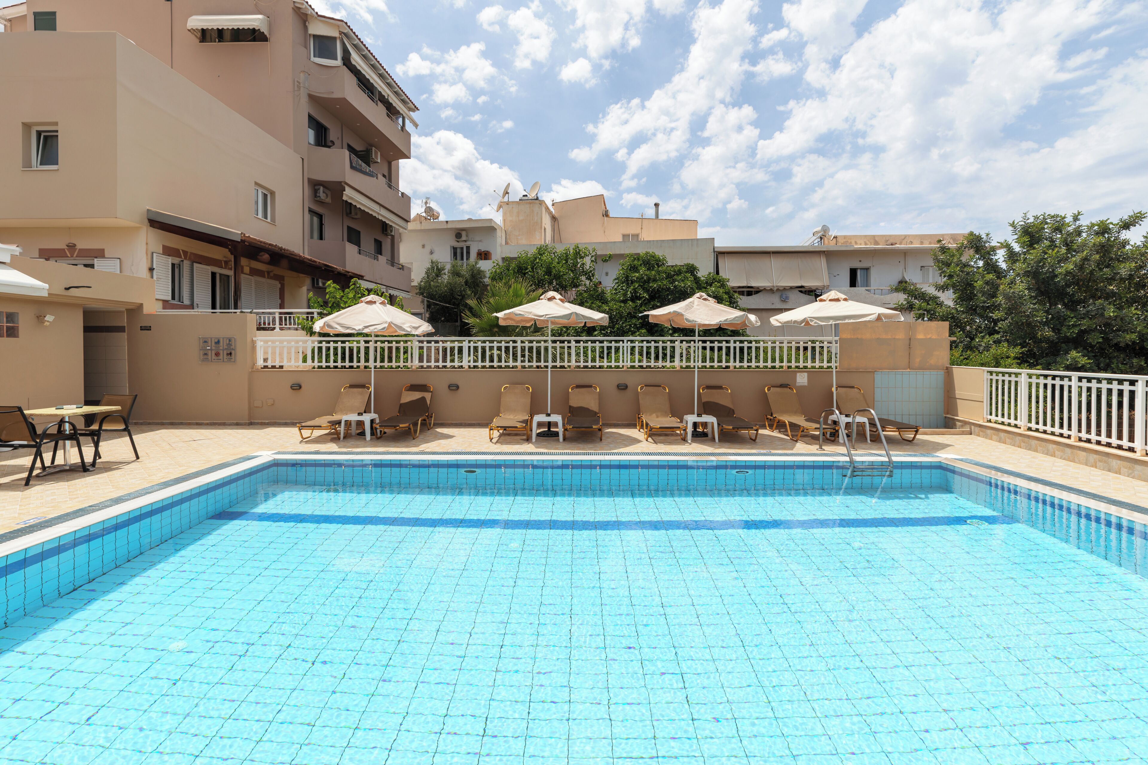 Seasonal outdoor pool, open 9:00 AM to 6:30 PM, pool loungers