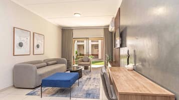 Luxury Apartment, Air conditioning | Living area | Flat-screen TV