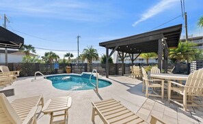 Outdoor pool, a heated pool - Steps from the sand! 4BR/3BA private home w/ heated pool, 6 seater gas golf cart (Panama City Beach, FL)