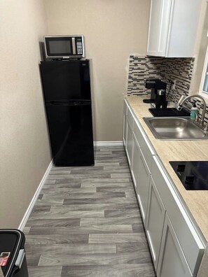 Fridge, microwave, stovetop, coffee/tea maker