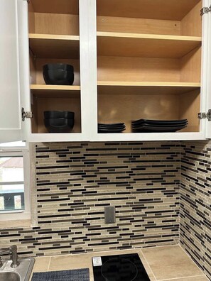 Fridge, microwave, stovetop, coffee/tea maker