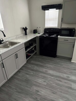 Fridge, microwave, oven, stovetop - Renovated Downtown Home (Lufkin)