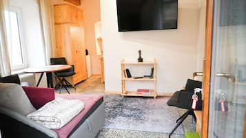 Familie appartement, kitchenette, uitzicht op tuin | Woonruimte