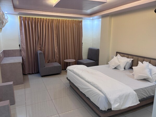 Deluxe Double or Twin Room, City View | Premium bedding, down comforters, memory foam beds, in-room safe - N.R. Hotel (Shri Madhopur)