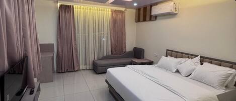 Premium bedding, down duvets, memory-foam beds, in-room safe