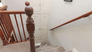 A wooden staircase with a baluster and a handrail. - Chamber End Fold (Skipton)