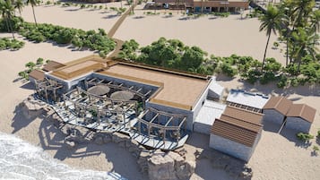 On the beach, white sand, beach towels, beach bar