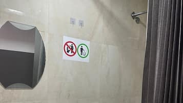 Shower, hair dryer, towels, shampoo