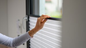 A hand adjusting a window blind. - Roatel Schopsdorf A2 (Schopsdorf)