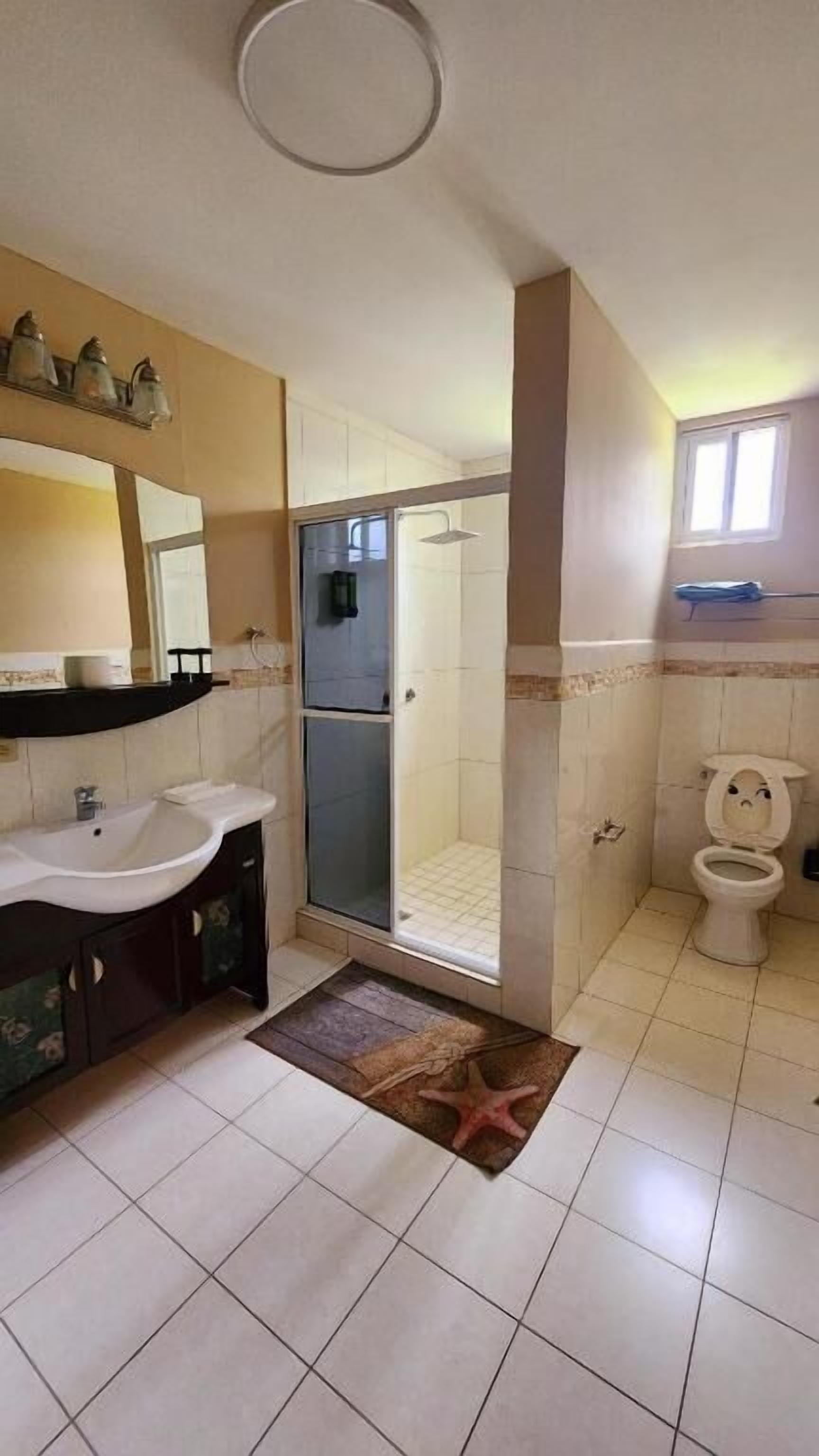 Deluxe Suite, Patio, Garden View | Bathroom | Shower, rainfall showerhead, free toiletries, hair dryer