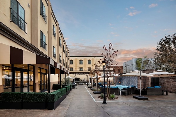 Stroll through the serene courtyard and relax by outdoor seating.