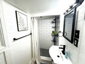 Shower, hair dryer, towels, soap