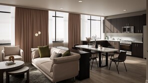 A modern living room with a sofa, coffee table, and dining area. - Vintedge Residences (Lyndhurst)