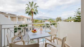 Superior Apartment, Pool View | Outdoor dining