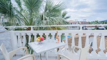 Family Apartment, Pool View | Outdoor dining
