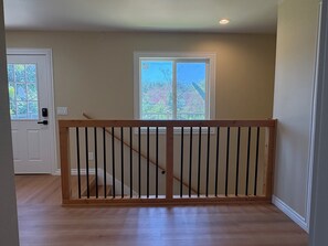 A staircase with a wooden railing leading to a landing. - New Spacious 3-bedroom house in Beautiful Alhambra (Alhambra)