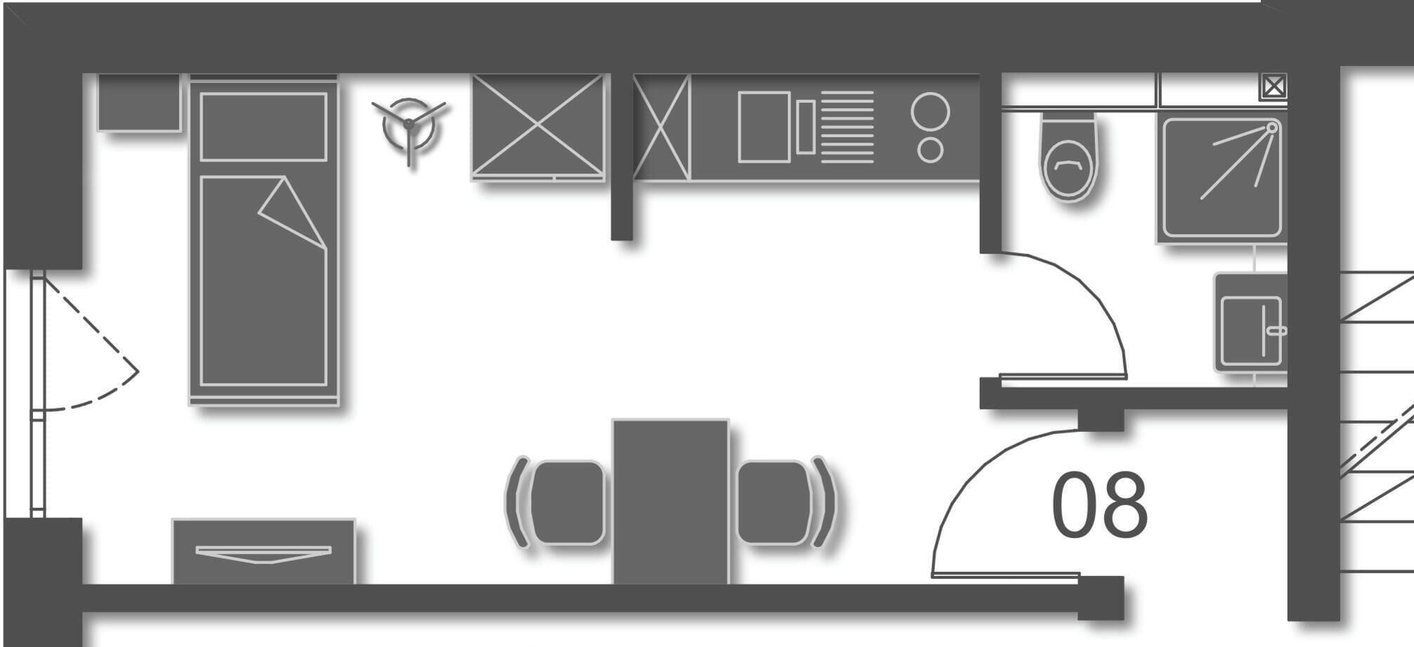 Ein Grundriss eines Hotelzimmers mit Bett, Schreibtisch, Stuhl, einem kleinen Tisch und einem Badezimmer.
