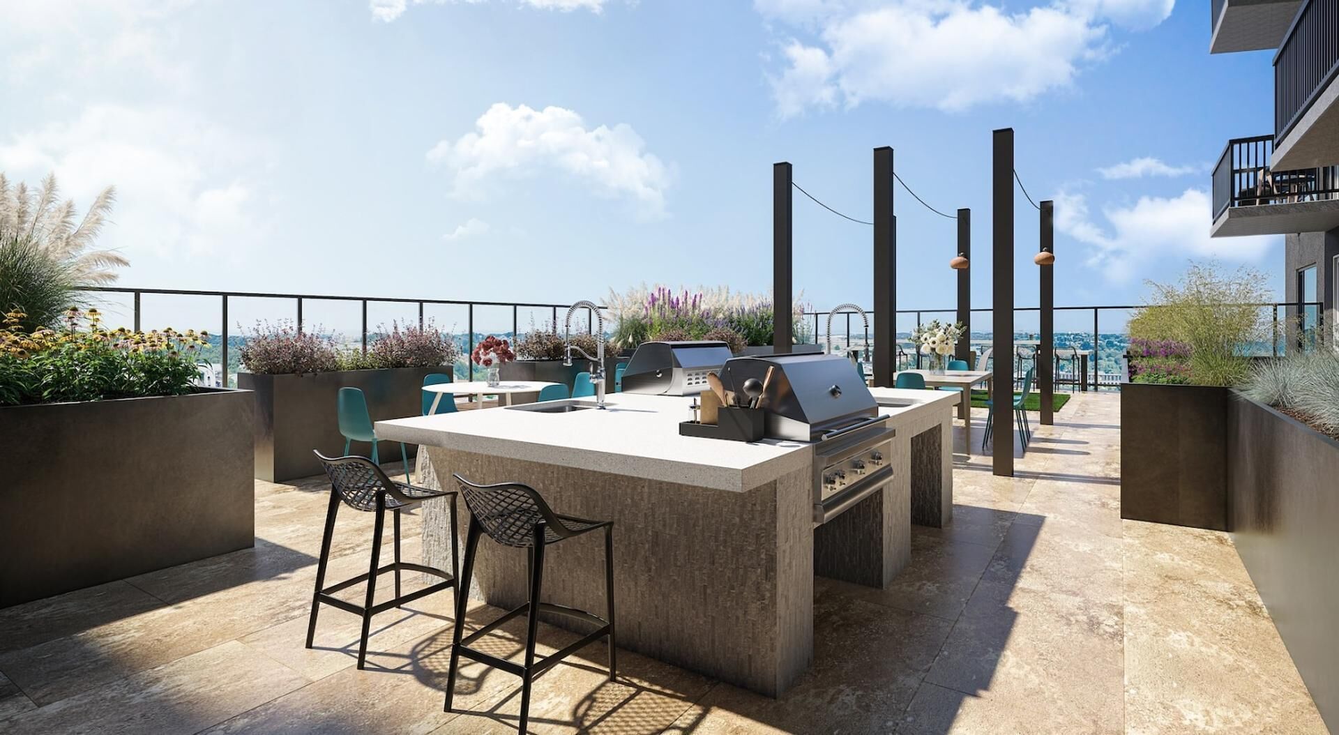 A rooftop patio with a bar area, outdoor seating, and a view of the cityscape.